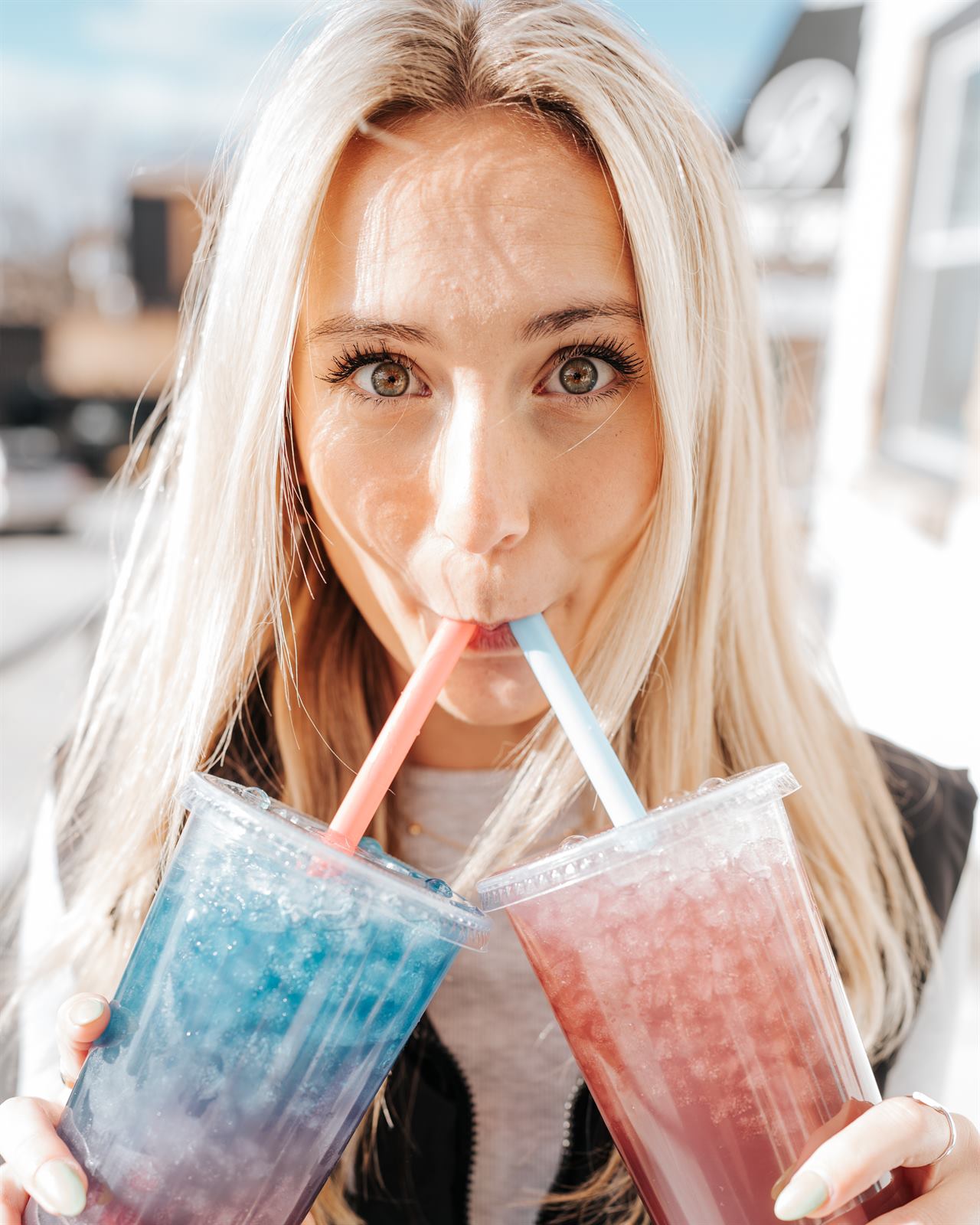 Ellie drinking two teas at once